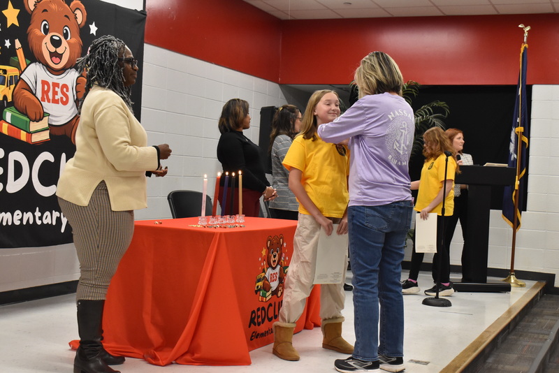 Studnt being pinned by guardian.