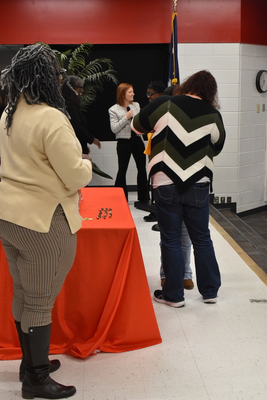 Student being pinned by guardian.