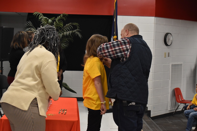 Student being pinned by guardian.