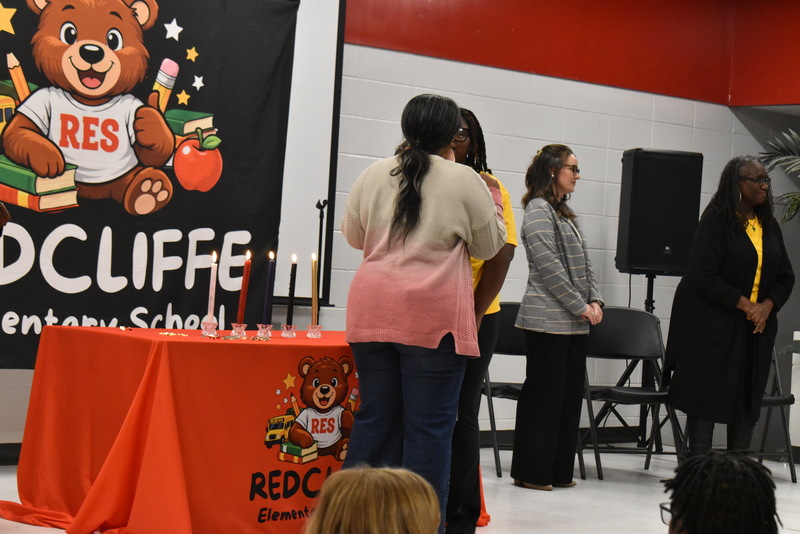 Student being pinned by guardian.