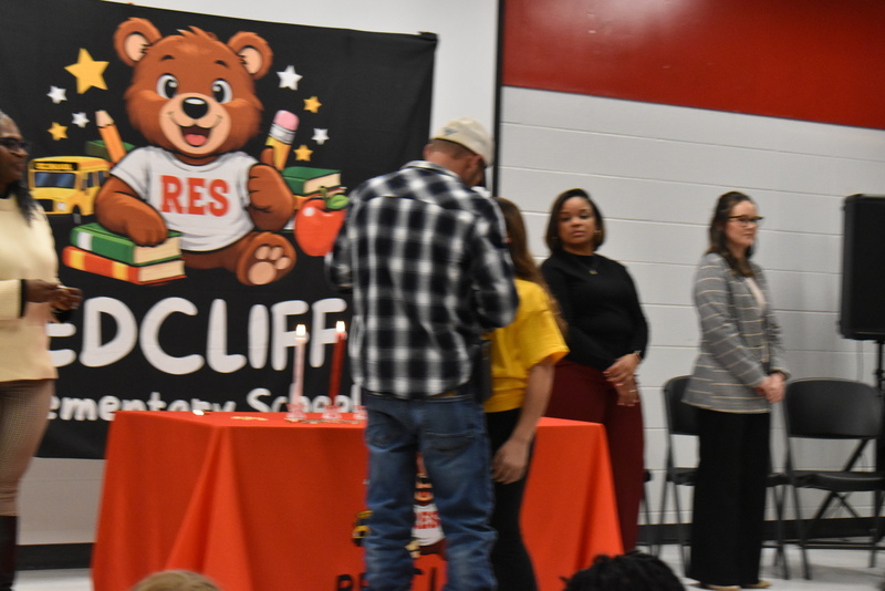 Student being pinned by guardian.