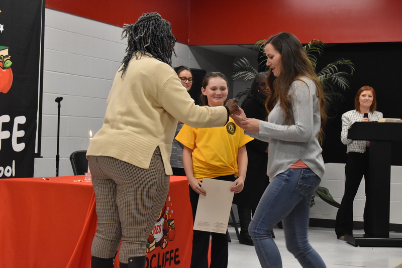 Student being pinned by family.
