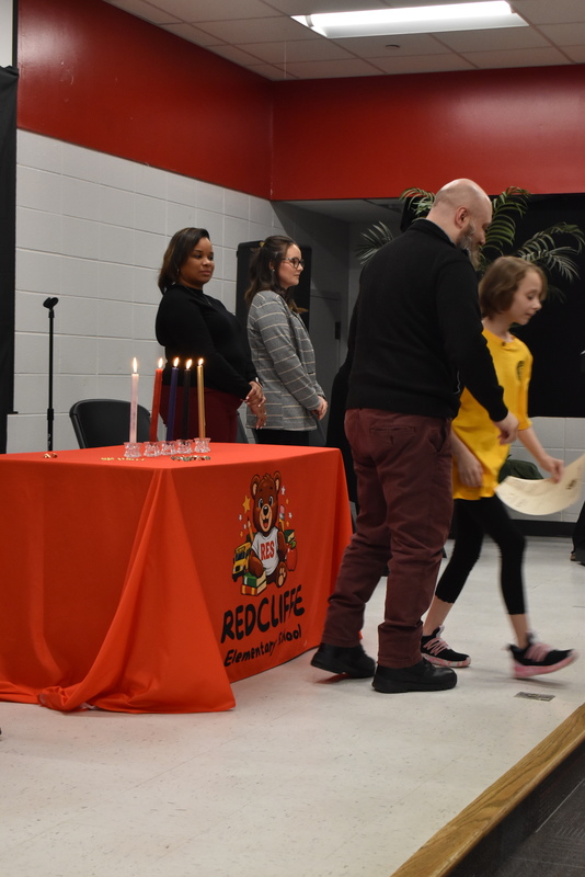 Student being pinned by family.