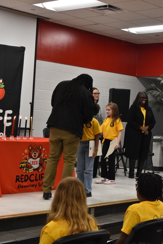 Student being pinned by fmaily.