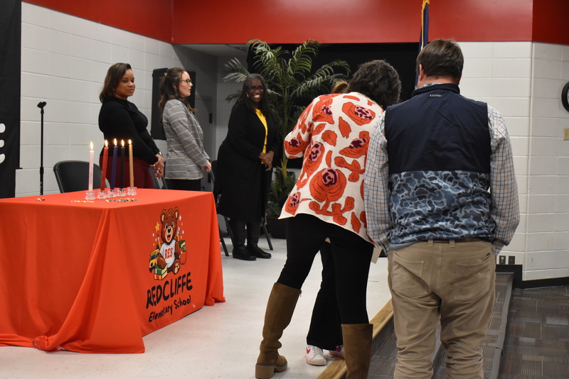 Student being pinned by family.