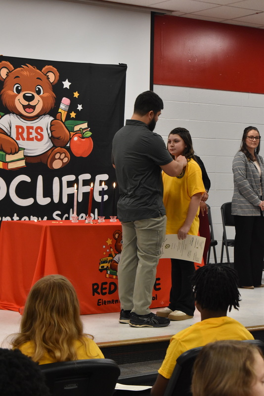 Student being pinned by family.