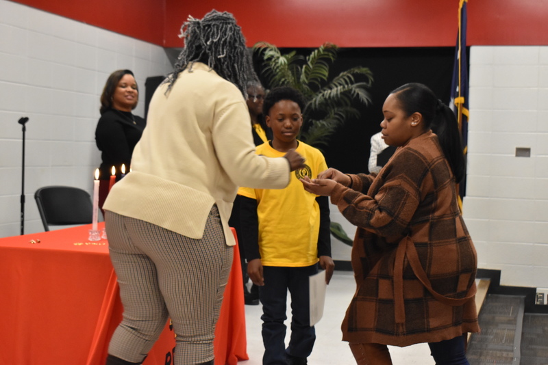 Student being pinned by family.