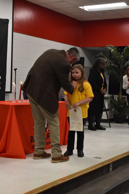 Student being pinned by family.