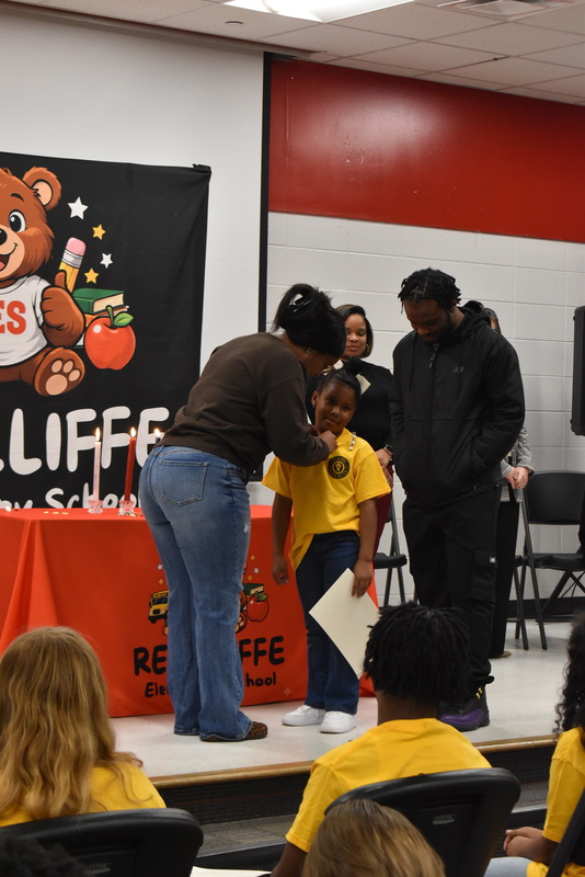 Student being pinned by family.