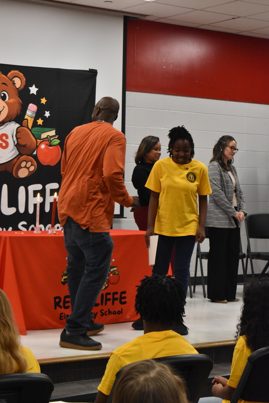Student being pinned by family.