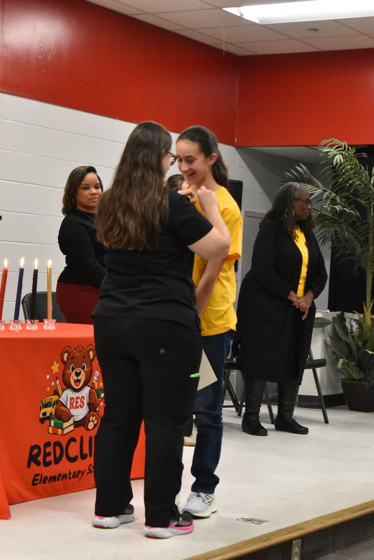 Student being pinned by family.