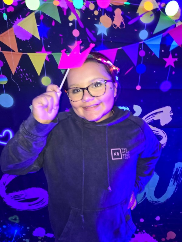 Students in glow party photo booth.