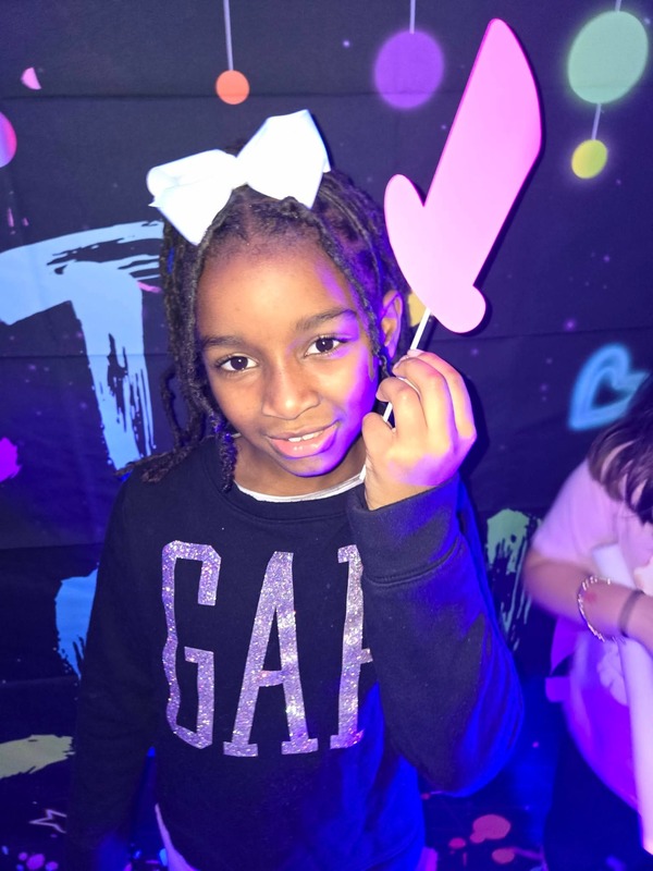 Students in glow party photo booth.