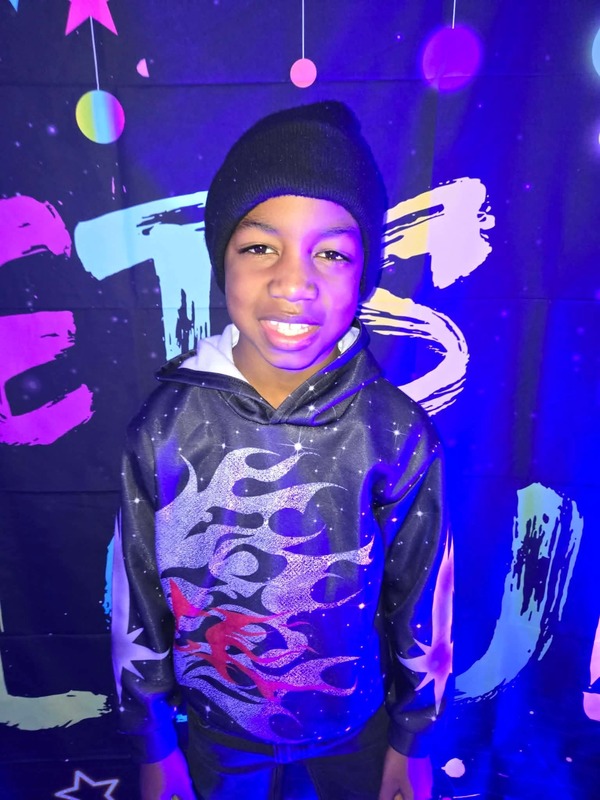 Students in glow party photo booth.