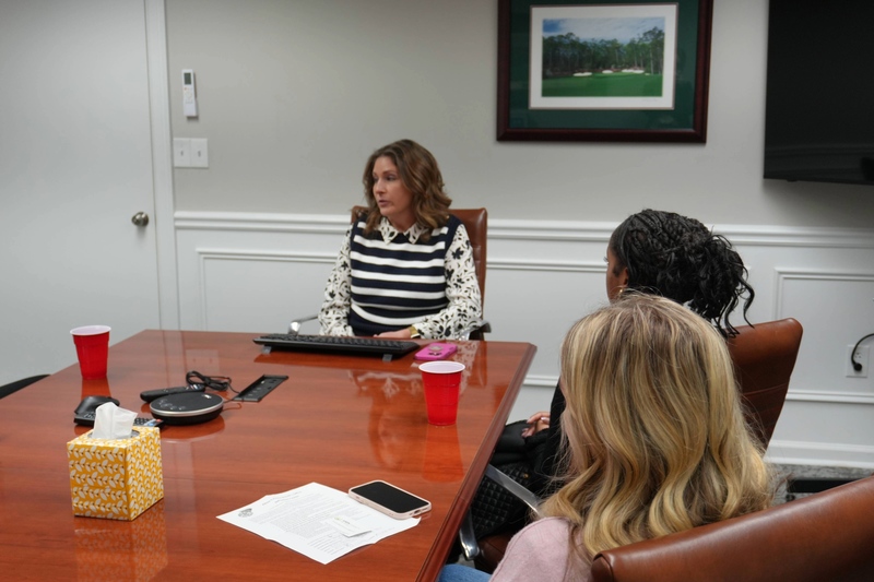 Students listening attentively to lawer.