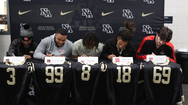 5 Players at football signing.