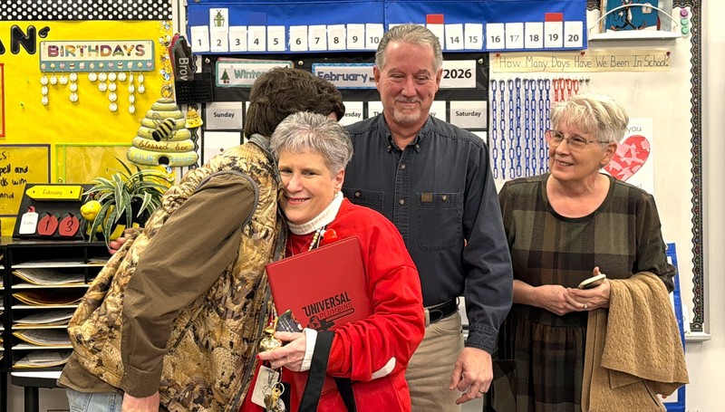 Christine Witt hugs her family.