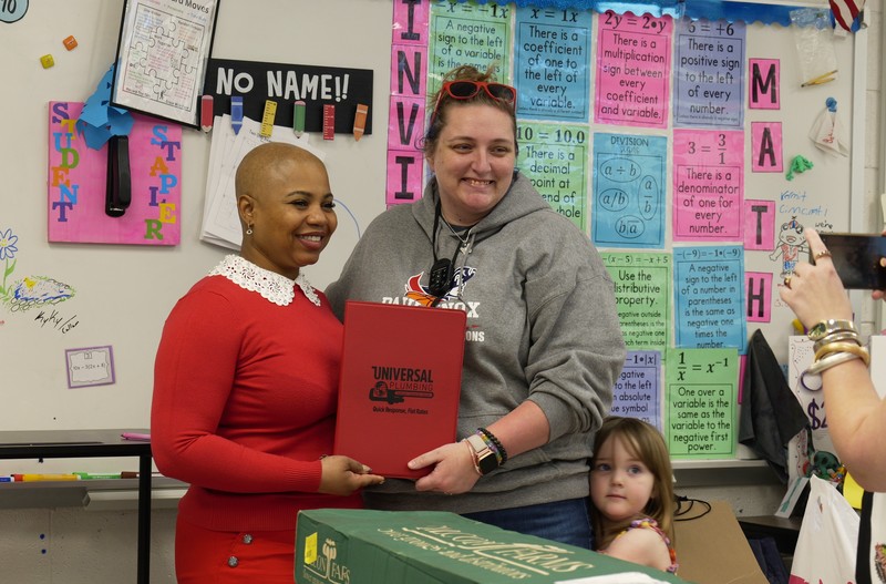 Heather Parliament receives a gift from a sponsor.