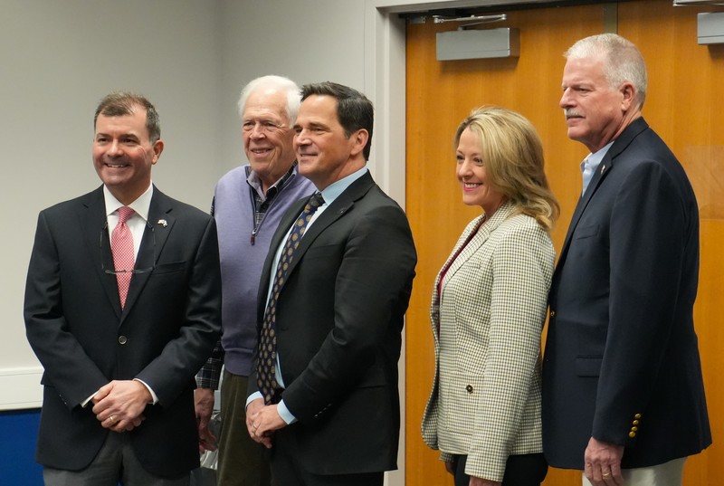 Local elected officials pose in group photo.