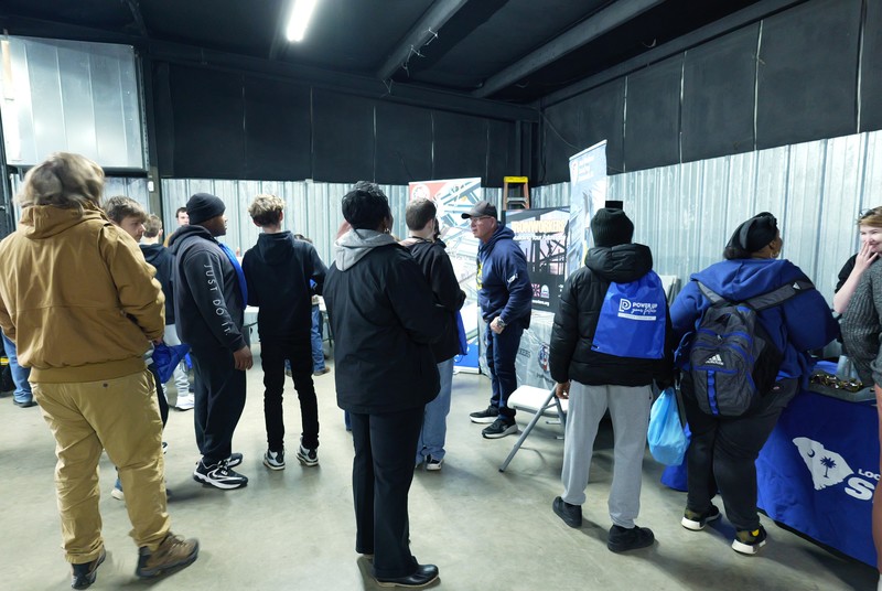 More students waiting to talk to instructors.