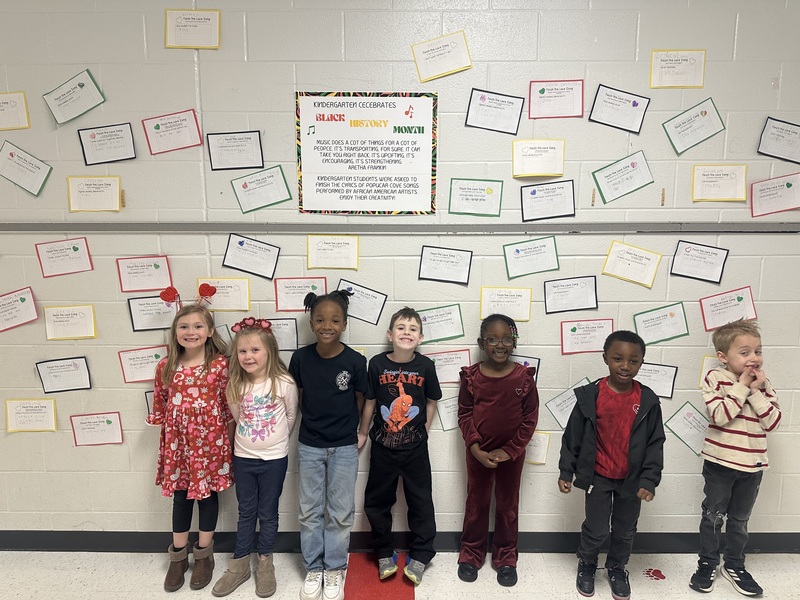 Students with work displayed.