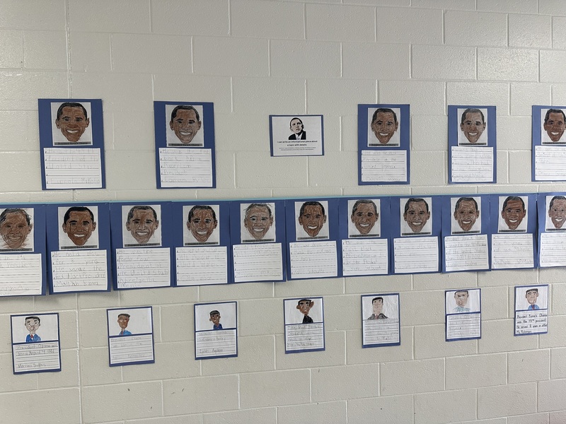 Student with work displayed.