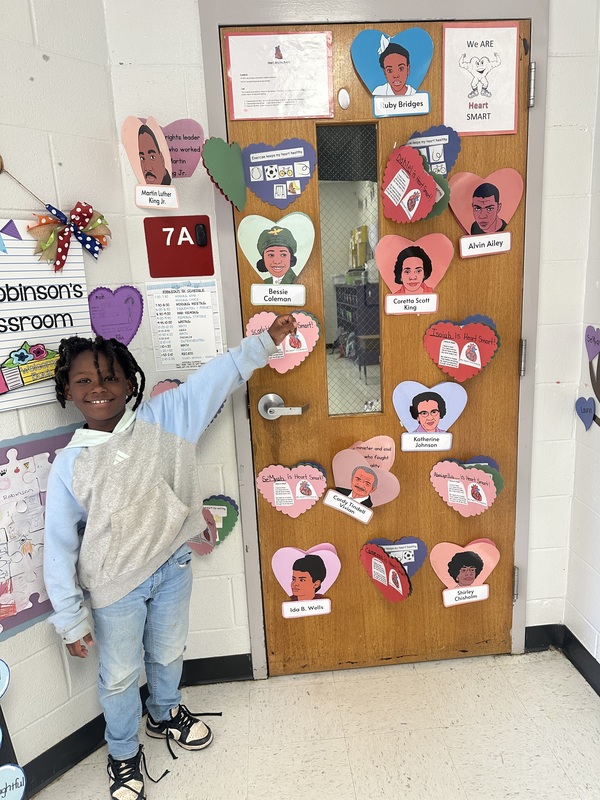 Student with work displayed.