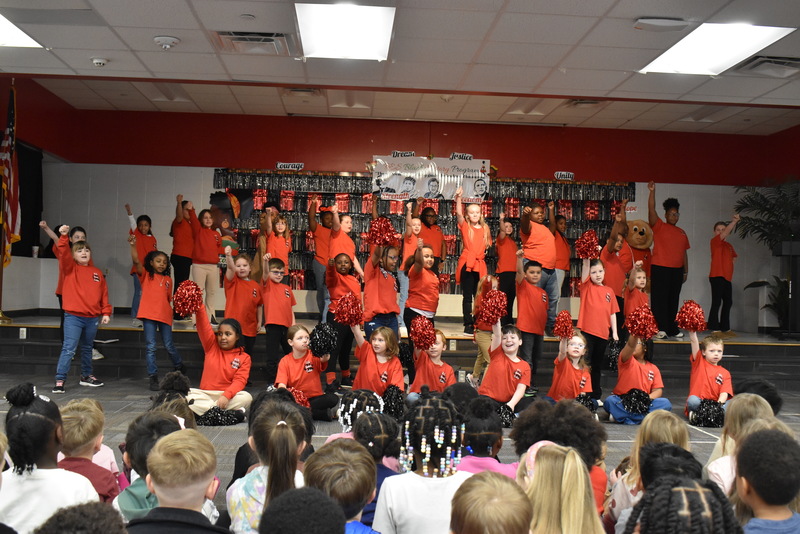 Bear Cub students performing on stage.