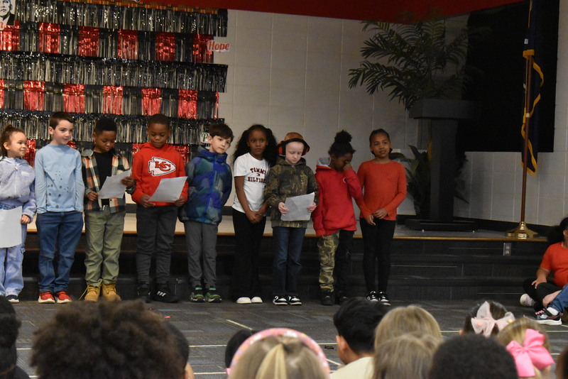 1st grade students performing on stage.