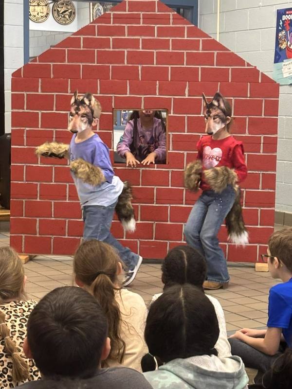 Two students dressed as wolves for the play.