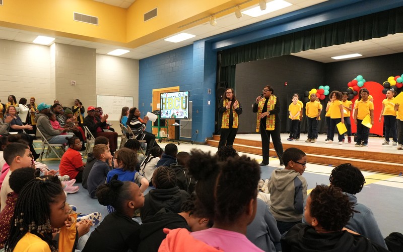 Students listen and watch the Black History Month speakers.