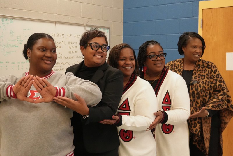 Sorority sisters pose for a photo.