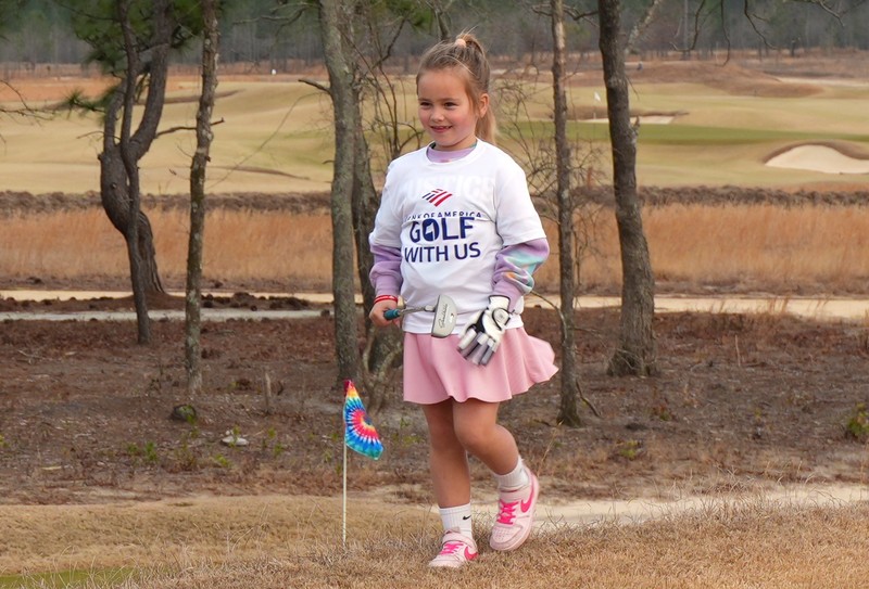 Oakwood-Windsor first grader Taylor Stephens smiles on the golf course.