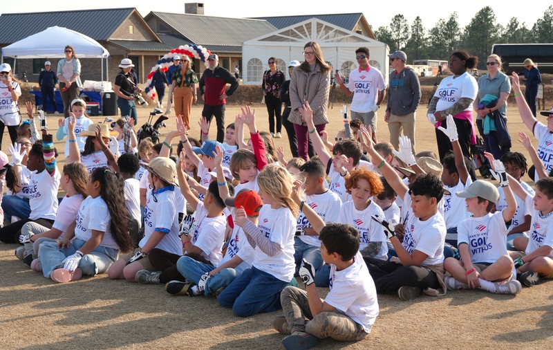Oakwood-Windsor students raise their hand at Old Barnwell Golf Course.