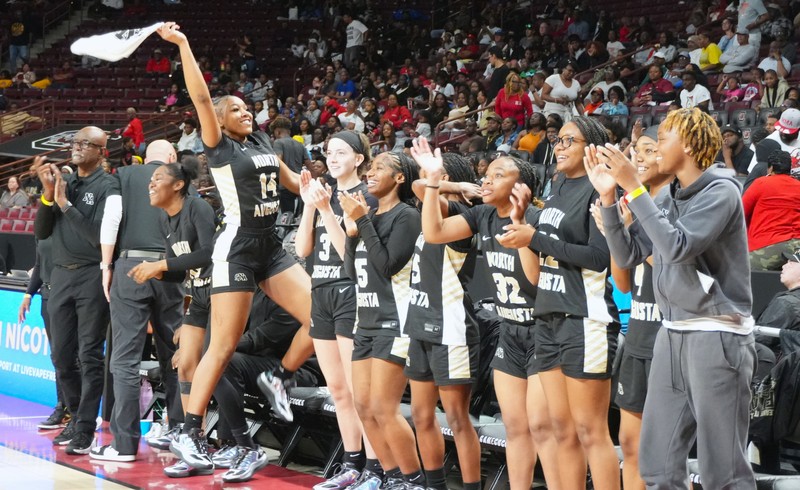 North Augusta Girls Team celebrates on the bench.