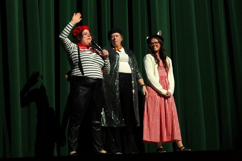 Mary Nicodemus, Stephanie Osorio, Eliza McManus all stand on stage to introduce the play.