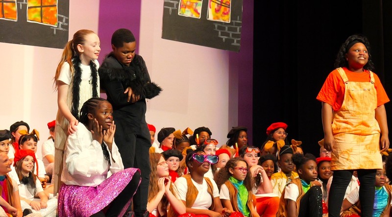 Students on stage performance. 