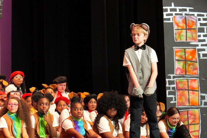 Student on stage performing.