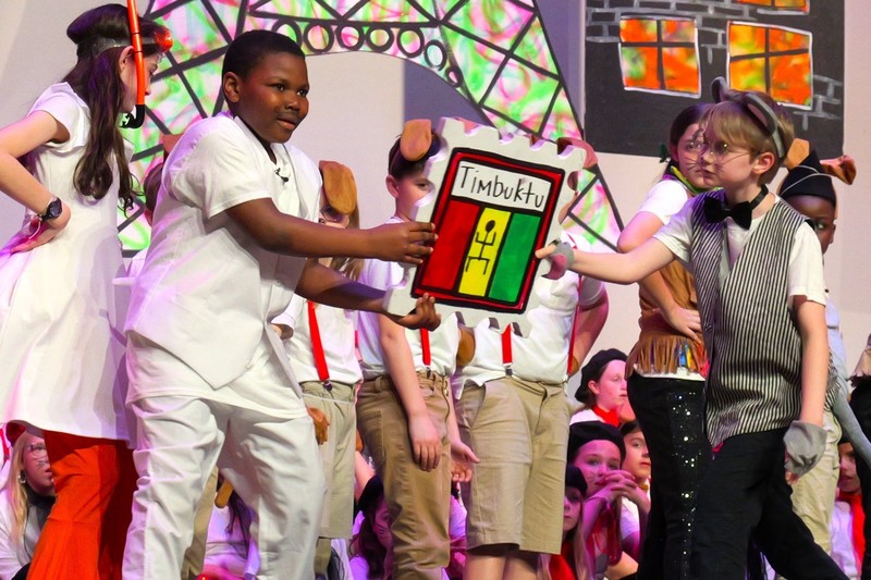 Students on stage performing.