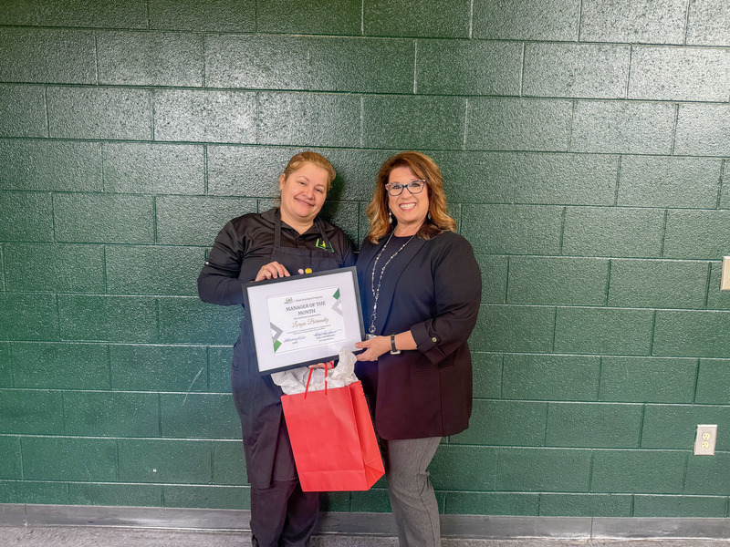 Child Nutrition Manager Lorgia Bermudez posing for a photo with Child Nutrition Coordinator Polly Peyinghaus