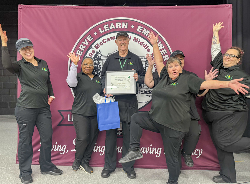 Child Nutrition Employee George Howe Stands with Child Nutrition staff of Leavelle McCampbell Middle for a photo