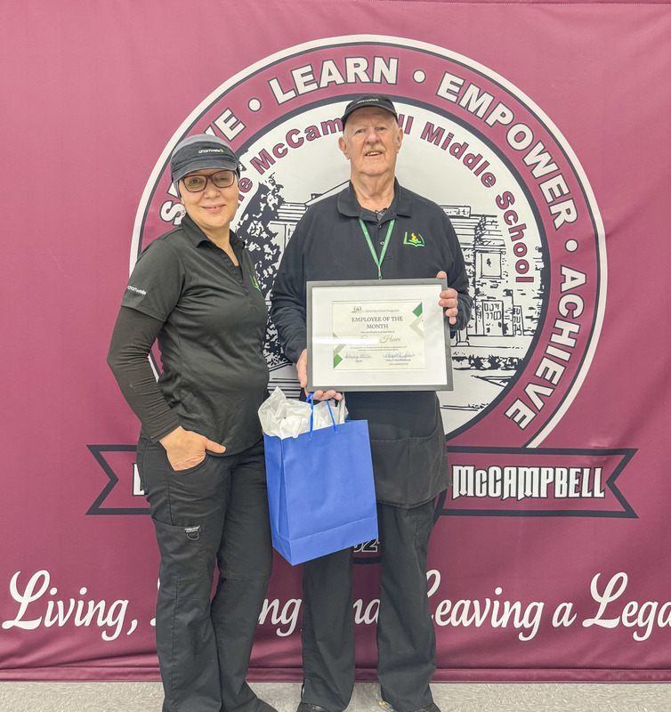 Child Nutrition Employee George Howe Stands with Child Nutrition Manager Asmae Khoukh for a photo