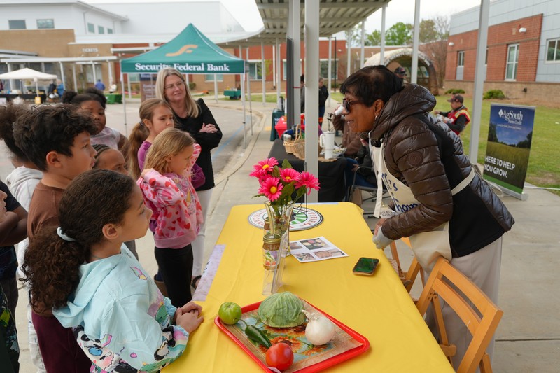 Students speak with one of the vendors.