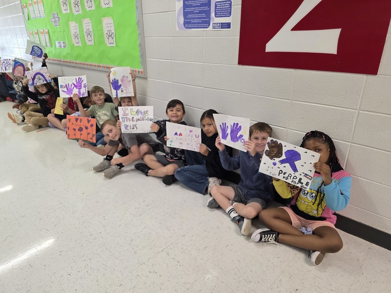 Students in hall with signs and streamers for parade.