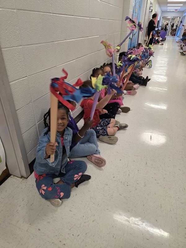 Students in hall with signs and streamers for parade.