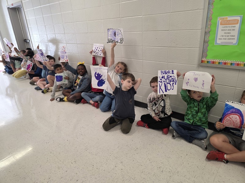 Students in hall with signs and streamers for parade.