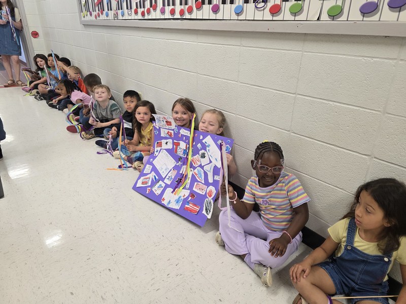 Students in hall with signs and streamers for parade.