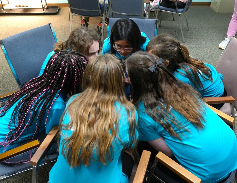 A group of students discuss books during Battle of the Books.