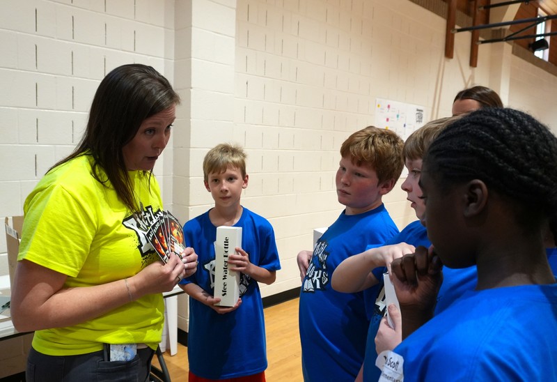Kennedy Middle school librarian Michelle King coaches up her team.