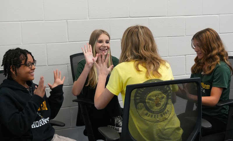 Aiken High School celebrates after getting a correct answer.